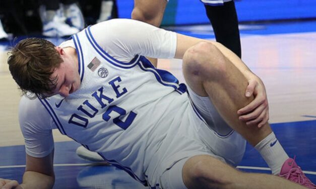 Duke’s Flagg helped off court after spraining ankle