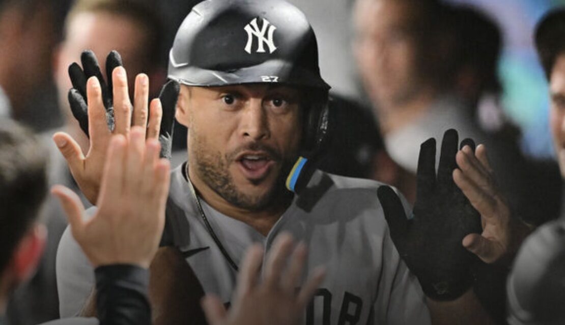 Yankees keep power surge going, hold off Rays in extras