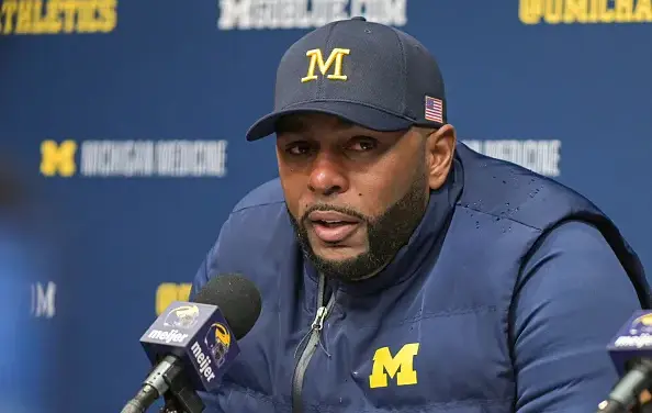 Moore detained by police after Michigan firing