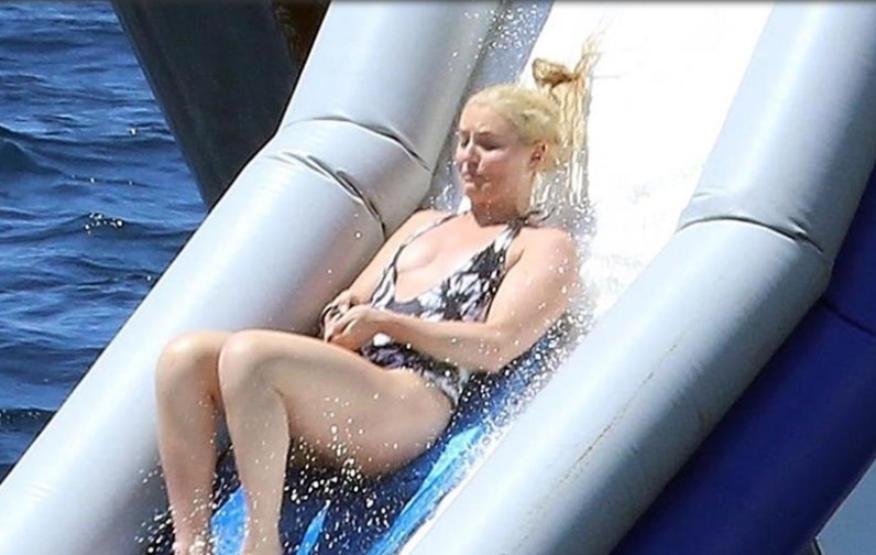 Winter Olympics star Lindsey Vonn is all smiles while enjoying the inflatab...